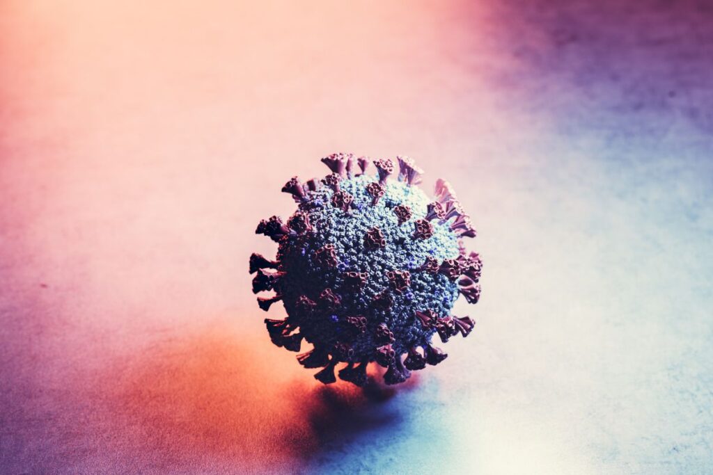 Coronavirus als Symbol für Pandemien und wirtschaftliche Risiken für Unternehmen.